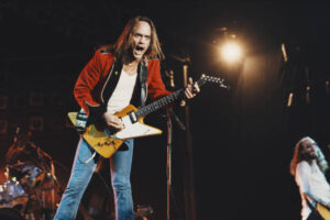 Rickey Medlocke, frontman of American Southern rock band Blackfoot, performs on stage with his guitar in  1982. 