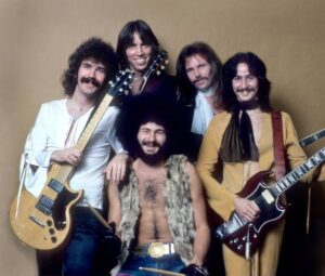 The band Boston posing for a photo in the 1970s  whith both guitarist holding their guitars