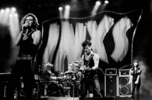 INXS, with lead singer Michael Hutchence, performs at the Coronado Theater in Rockford, Illinois, August 9, 1986.