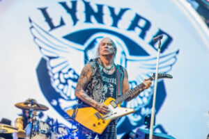 Lynyrd Skynyrd Guitarist Ricky Medlock playing his guitar on stage