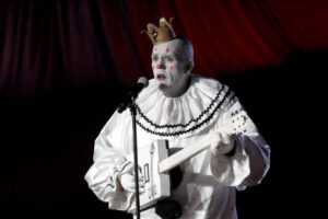 Puddles Pity Party The Clown playing his guitar