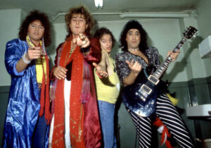 Y&T in colorful garments  posing for a picture in the 80's
