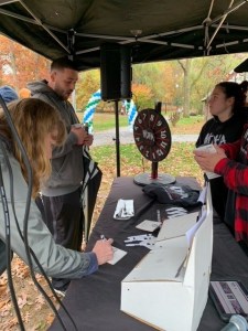 Attendees Entering To Win Concert Tickets at the DHA Table